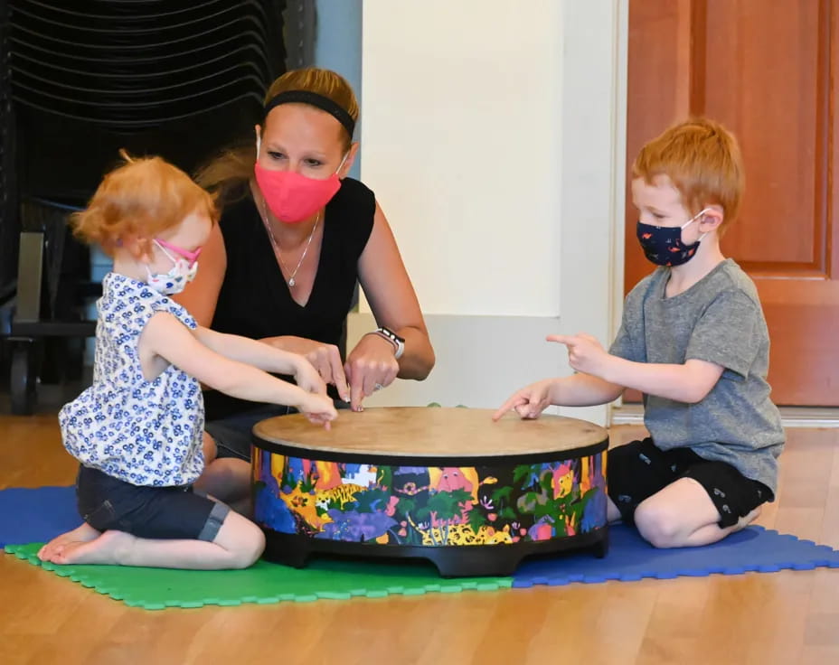 a group of children wearing masks