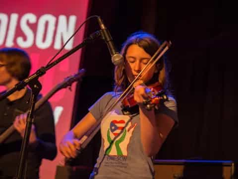 a person singing on stage