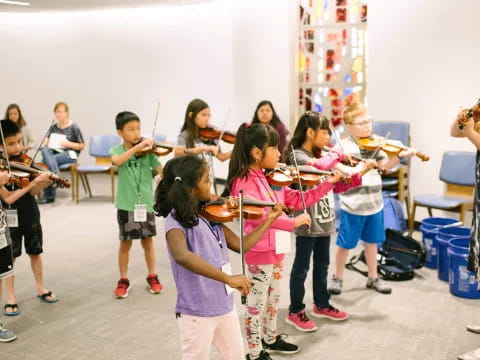 a group of kids playing instruments