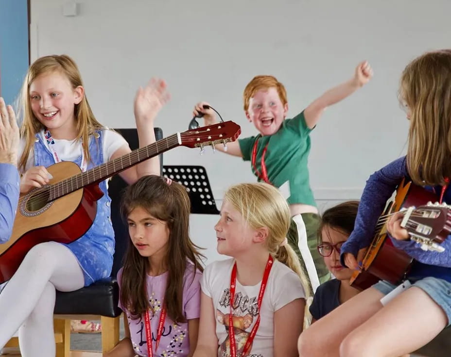 a group of people sitting and playing instruments