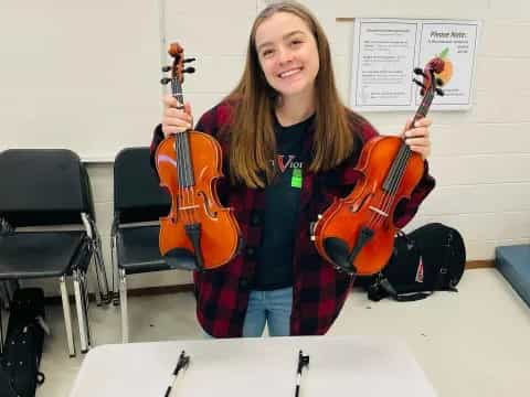 a person holding a violin