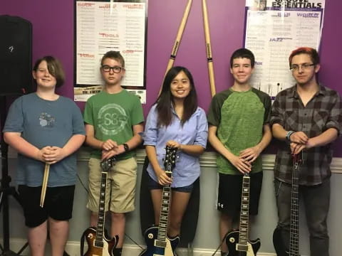 a group of people holding instruments