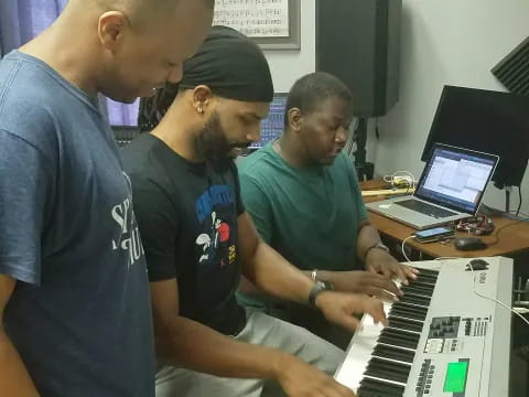 a group of men playing piano