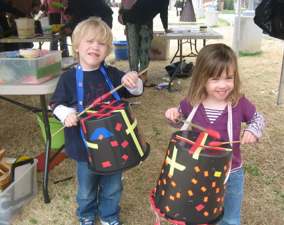 a couple of children holding shopping bags