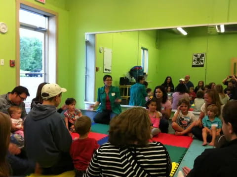 a group of people sitting in a room