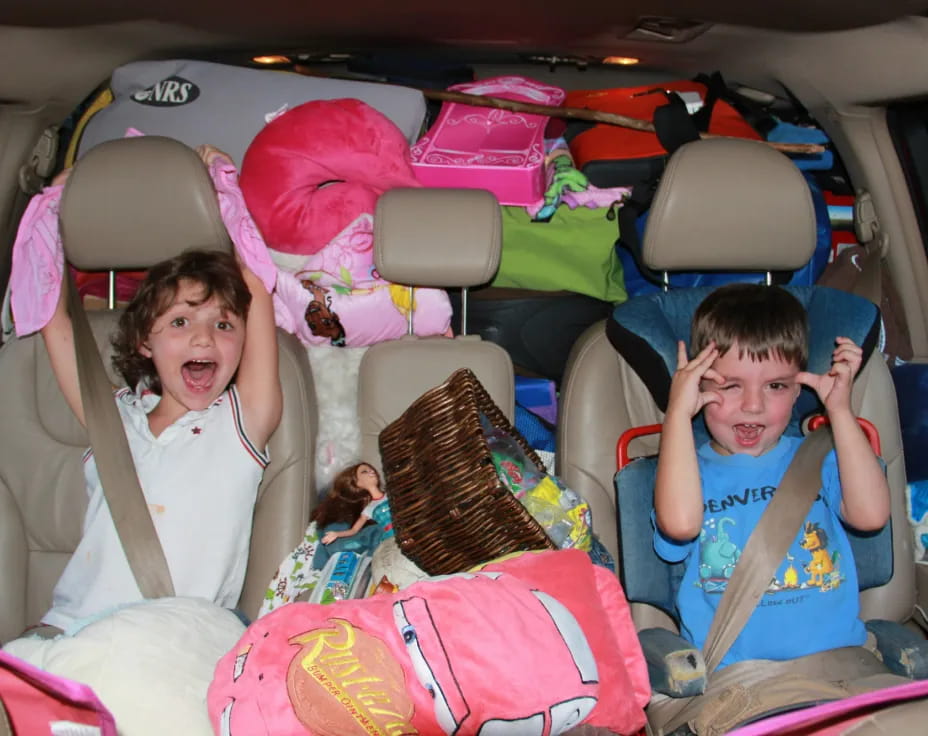 a group of kids in a car