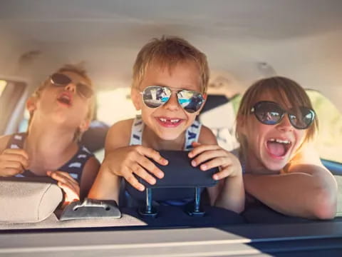 a group of kids in a car