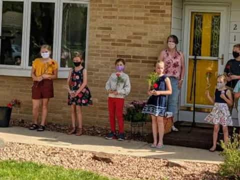 a group of people standing outside a building