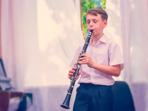 a boy playing a saxophone
