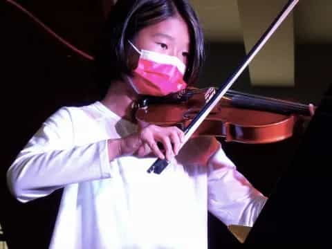 a person playing a violin