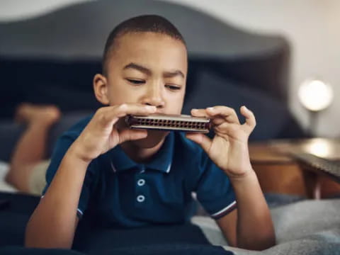 a boy holding a phone