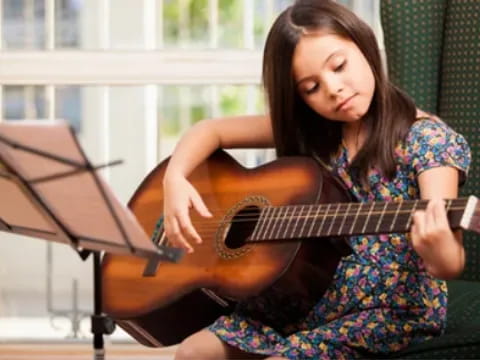 a person playing a guitar