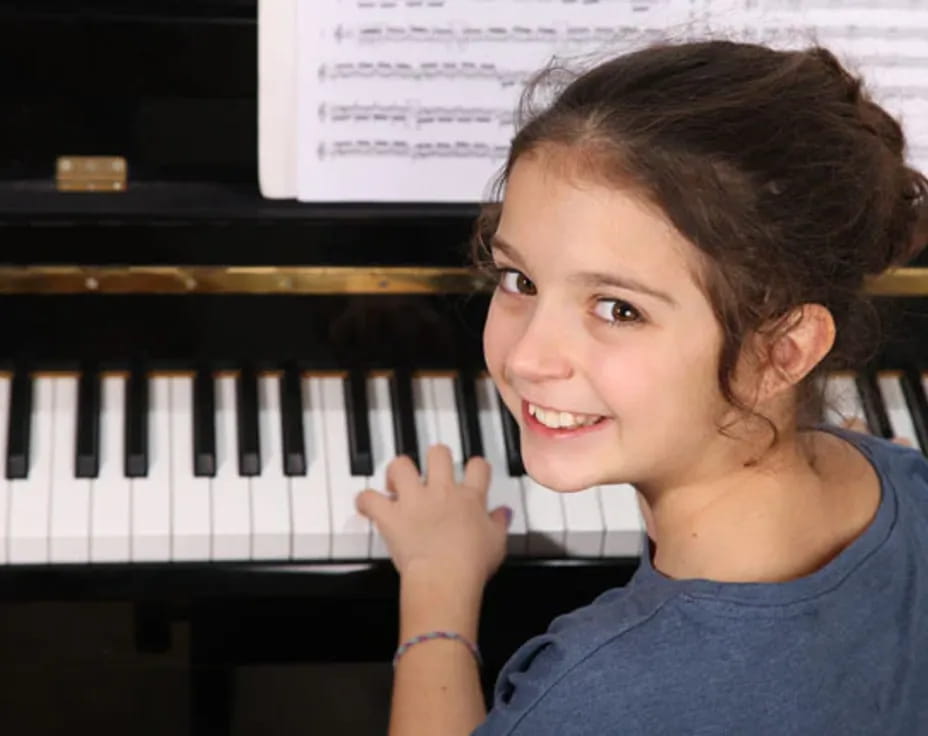 a young girl smiling