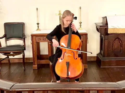 a person playing a cello