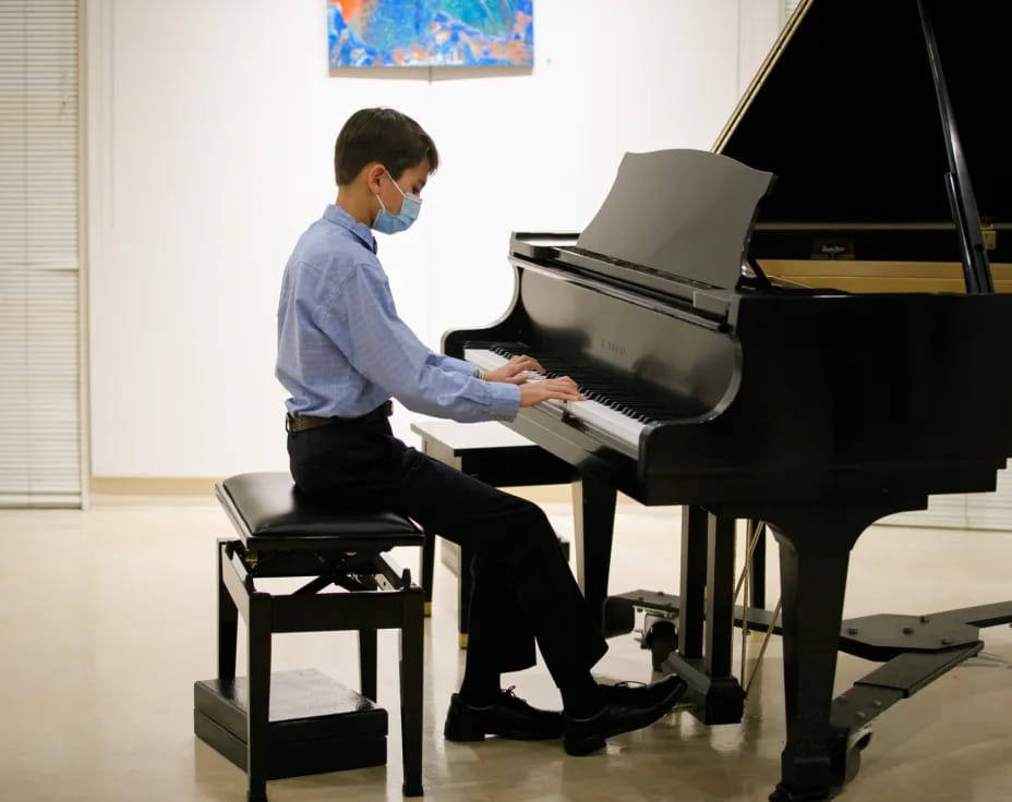 a man playing a piano