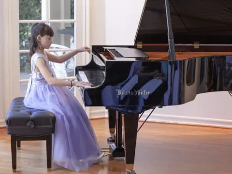 a woman playing a piano