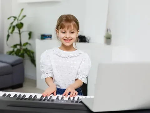 a child sitting at a computer