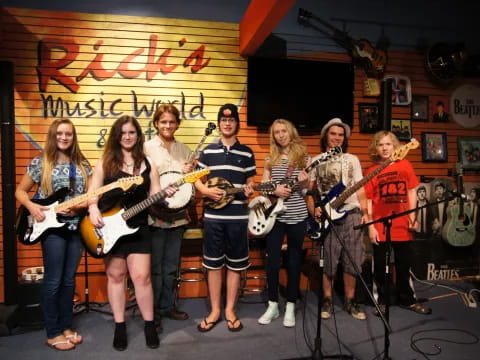 a group of people holding guitars