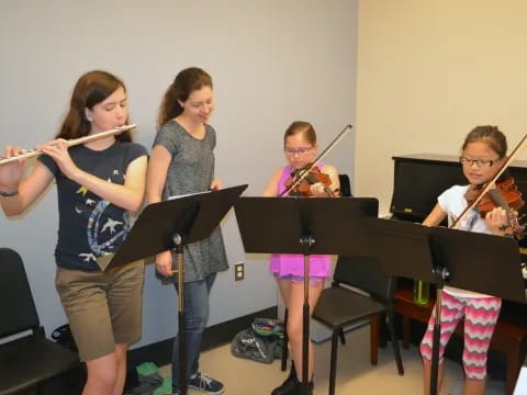 a group of kids playing musical instruments