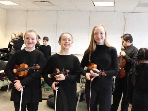 a group of people holding instruments