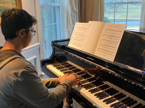 a person playing a piano