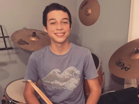 a boy playing drums