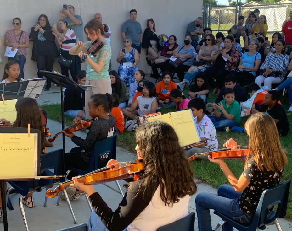 a group of people playing instruments