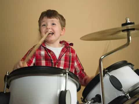 a boy playing drums