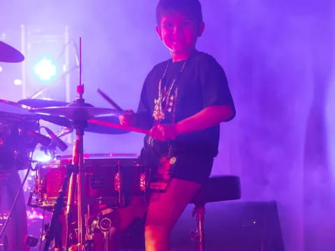 a boy playing the drums