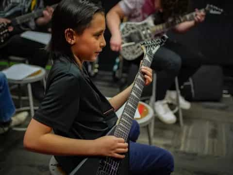 a man playing a guitar