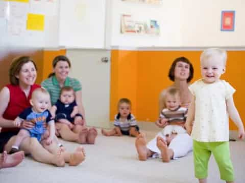 a group of children sitting on the floor