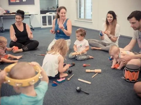 a group of people sitting on the floor