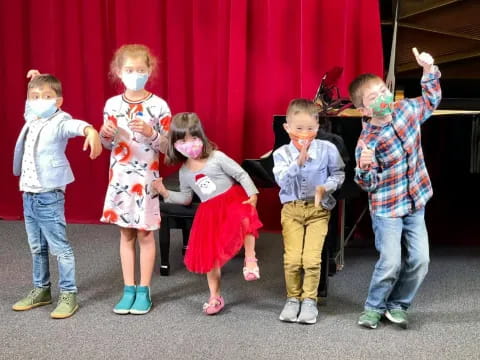 a group of children posing for a photo