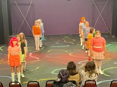 a group of children on a stage