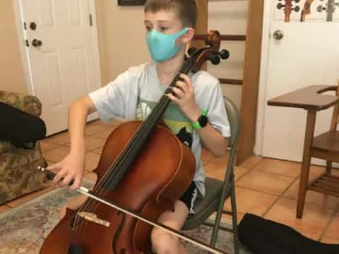 a boy playing a guitar