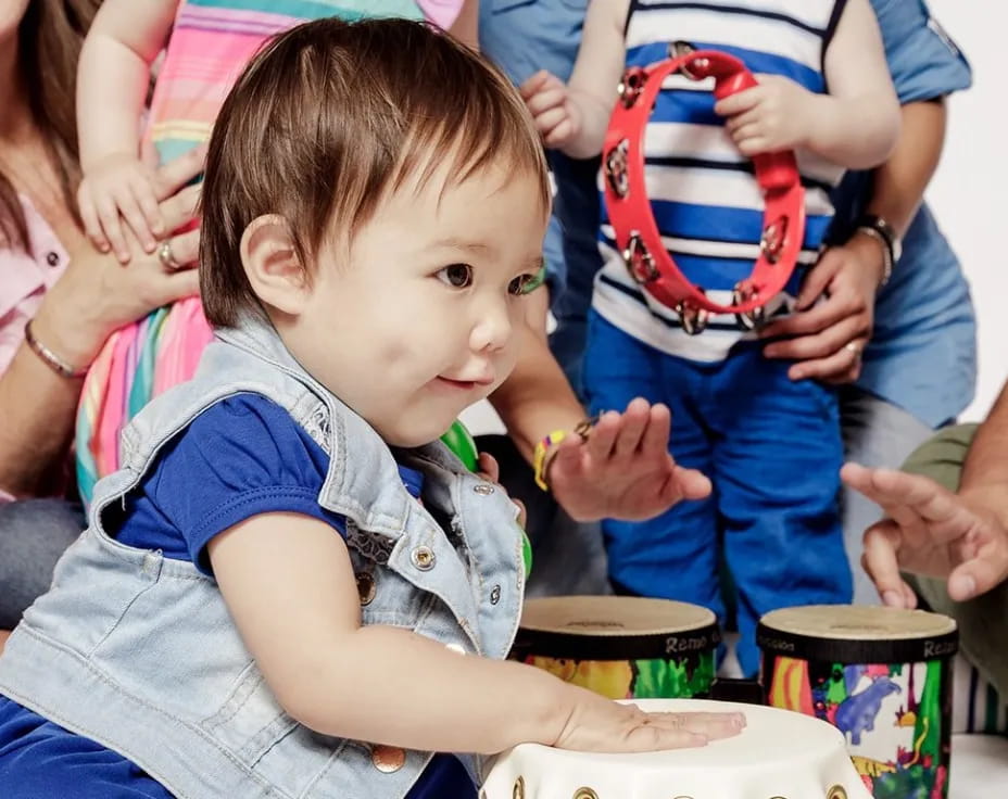 a child sitting in a crowd