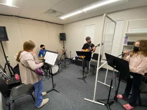 a group of people playing instruments