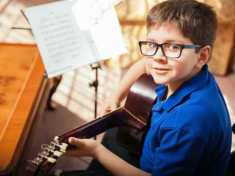 a boy playing a violin