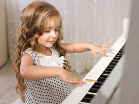 a girl playing a piano