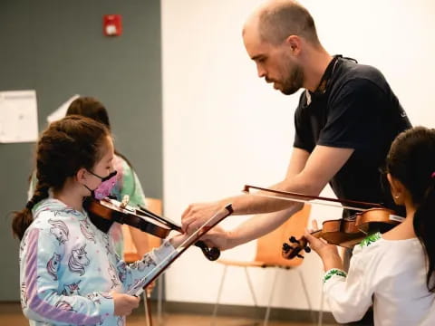 a person teaching a group of children