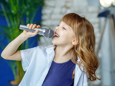 a person singing into a microphone