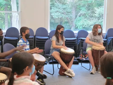 a group of people sitting in chairs