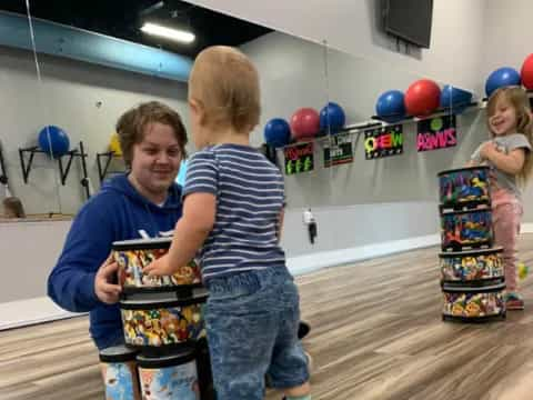 a group of children playing with toys