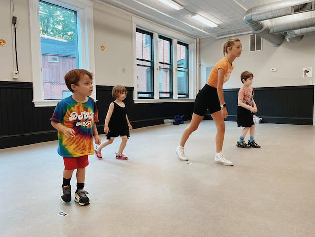 a group of kids playing in a room