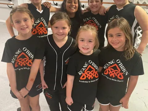 a group of girls wearing matching t-shirts
