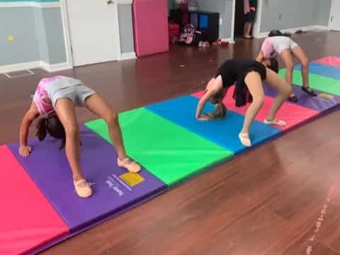 a group of women doing yoga
