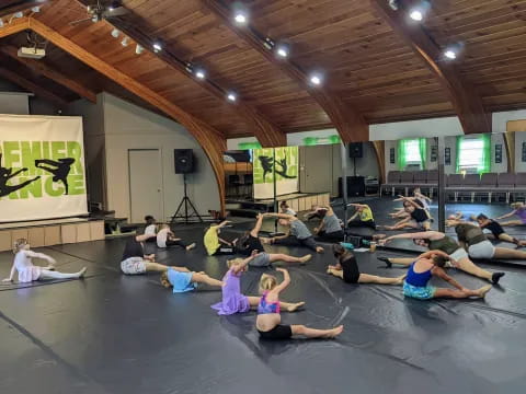 a group of people exercising in a room