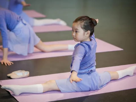 a young girl doing yoga