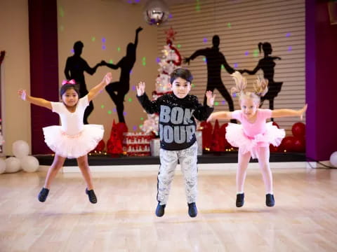 a group of children dancing on a stage