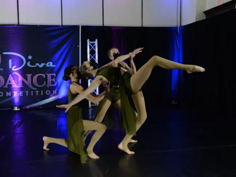 a group of people dancing on a stage